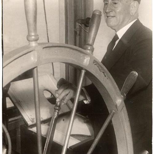 [Captain Arthur Jensen at the helm of the ferryboat "Charles Van Damme"]