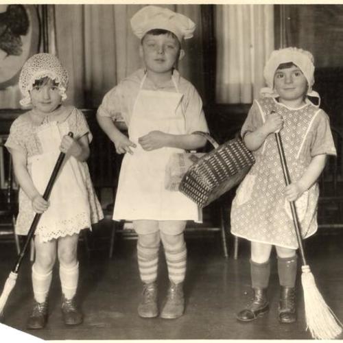 ['Mrs. Nellie' and 'Mrs. Gladys' with 'Bill the Butcher' at one of the Community Chest agencies]