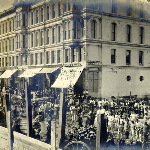 [Group of people standing on New Montgomery Street at the site of the Grand Hotel]