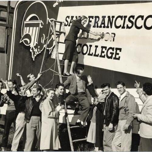 [Group of San Francisco Junior College students celebrating school's name change to City College of San Francisco]