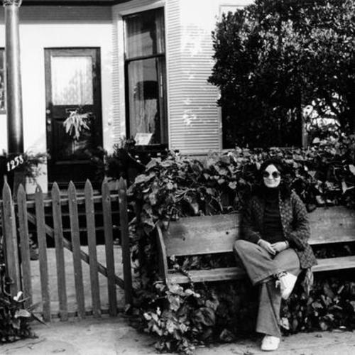 [Rosemary Robles sitting outside of a house on 5th Avenue, in the Sunset district, near Lincoln Boulevard]