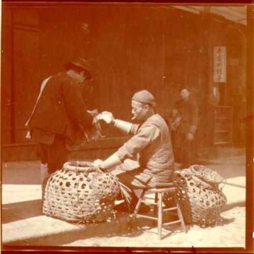 [Basket maker weaving a basket in Chinatown]
