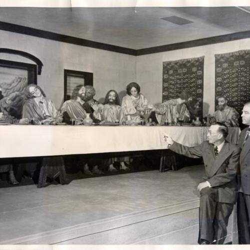 [Playland at the Beach owner George Whitney showing a life-sized reproduction of Leonardo Da Vinci's "The Lord's Last Supper" to Harold A. Meyer]