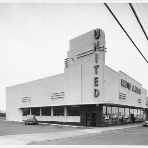 [Exterior of United Market grocery store]