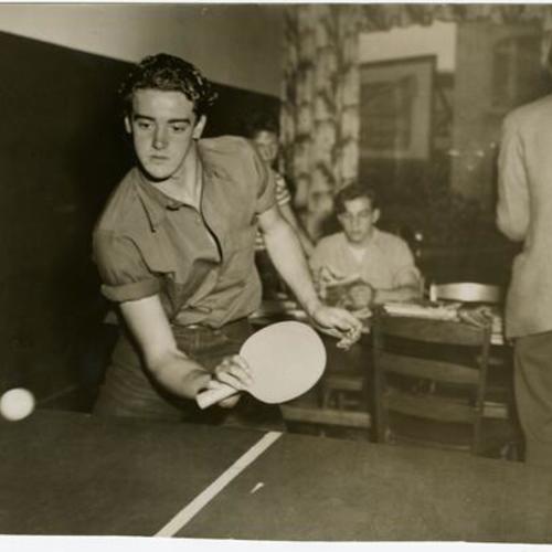 [Thomas McGuire playing ping pong at the Mission Teen-age Center in the Mission district]