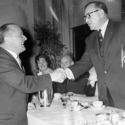 [Governor Edmund Brown shakes hands with William F. Knowland]