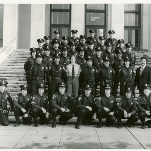 [The first wave of Asian American police officers sworn into the San Francisco Police Department force along with Bonnie and Melvin on the steps of the Science Hall at City College]