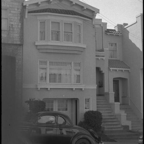 Residence exterior with Peter Mintun's father's 1936 Ford coupe parked outside