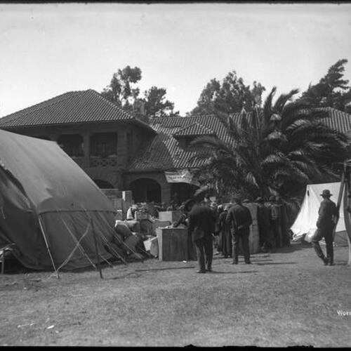 Refugee tents and supplies in front of McLaren Lodge after earthquake