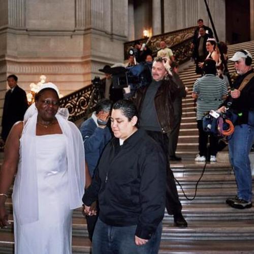 [Couple leaving San Francisco City Hall after getting married]