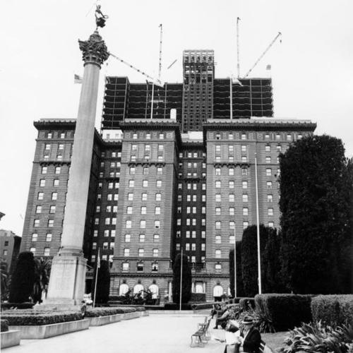 [View of construction of St. Francis Hotel Tower from Union Square Park]