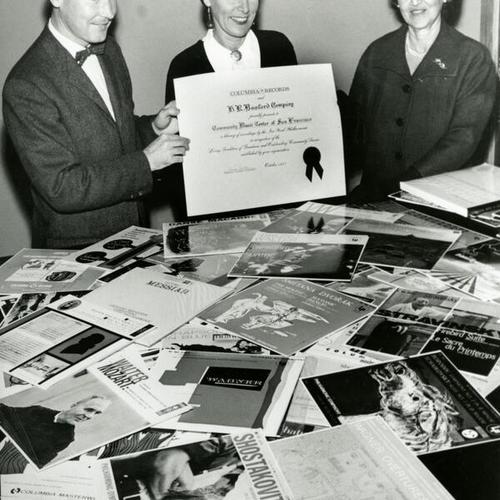 [Community Music Center director Margaret Jensen receiving a certificate from Columbia Records]