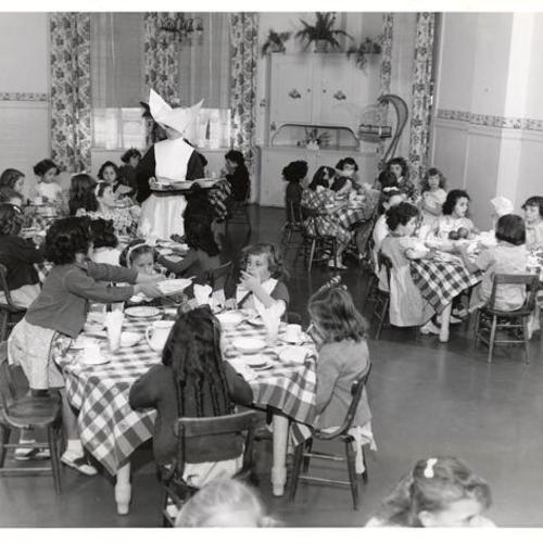 [Children eating a meal at Mount St. Joseph Orphanage]