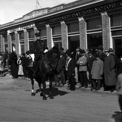 [San Francisco Police Chief John Seymour on horseback in front of onlooking crowd]
