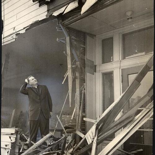 [Rev. Charles J. Durkin watching the demolition of St. Patrick's Grammar School]