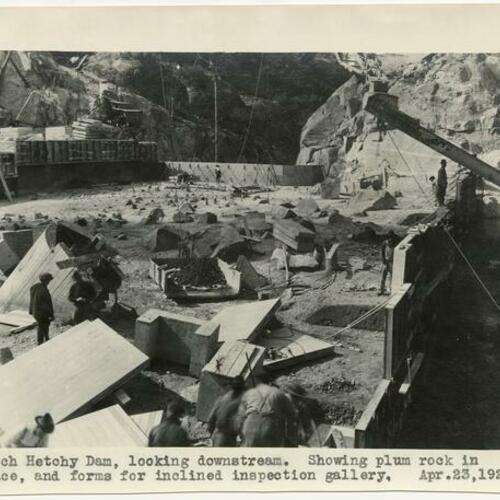 Hetch Hetchy Dam, looking downstream. Showing plum rock in place, and forms for incline inspection gallery
