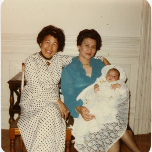 [Baby Kristina being held by her two aunties and members of the Filipino Community of San Francisco]