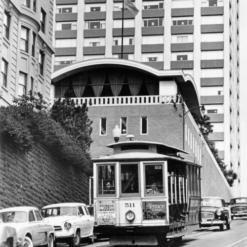 [Cable car passing in front of the Fairmont Hotel]