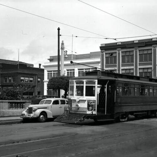 [Hayes west of Van Ness looking northeast at #21 line car 117 heading outbound]