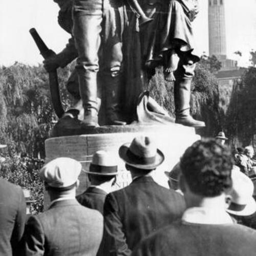 [Crowd gathered around bronze statue in Washington Square Park commemorating the Volunteer Fire Department of 1849 - 1866]