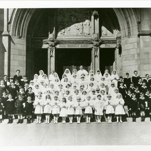 [First Communion participants standing on steps of Saint Dominic's Church, May 1937]