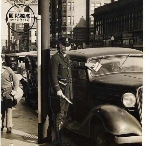 [Police officer John J. Kelly issuing parking citation ticket to a vehicle]