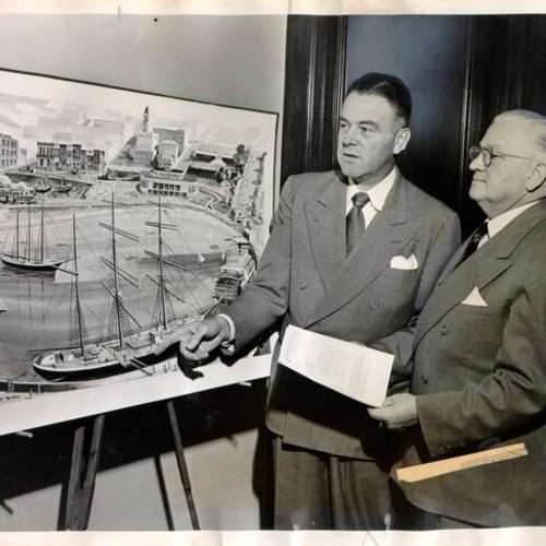 [Edward Harms showing Mayor Elmer E. Robinson drawing of proposed maritime museum at Aquatic Park]
