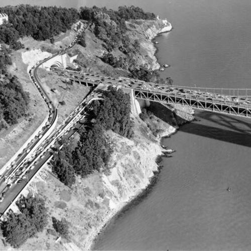 [Aerial view of traffic jam on Treasure Island and Bay Bridge]