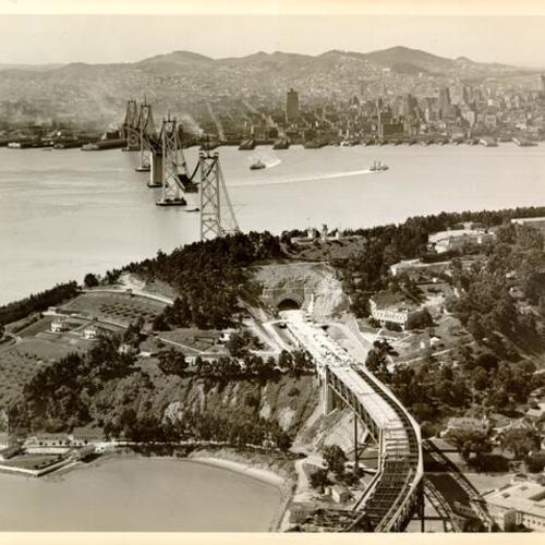 [Aerial view looking west toward San Francisco showing West Bay Crossing span and Yerba Buena Island span of San Francisco-Oakland Bay Bridge during construction]