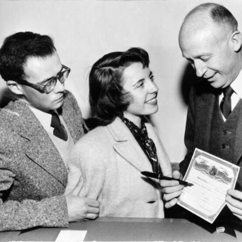 [Dion Chesse, Virginia Arnett and Dave Dunn at the Marriage Licence Bureau in City Hall]