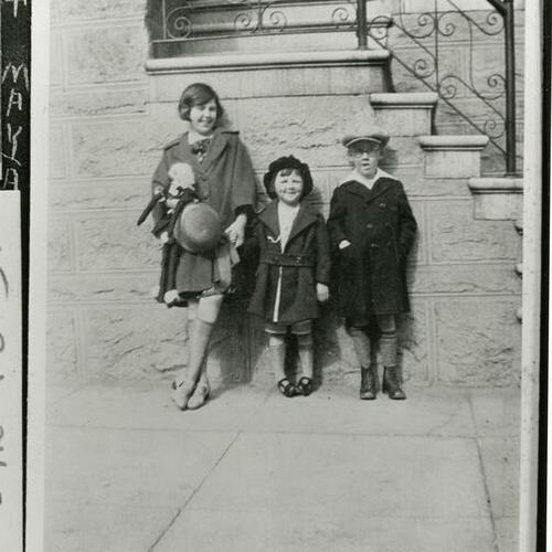 [Lorraine standing with two friends on Laguna Street in 1925]