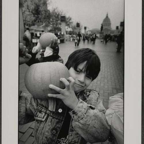 Tenderloin children with pumpkins at Harvest Festival in October 1988