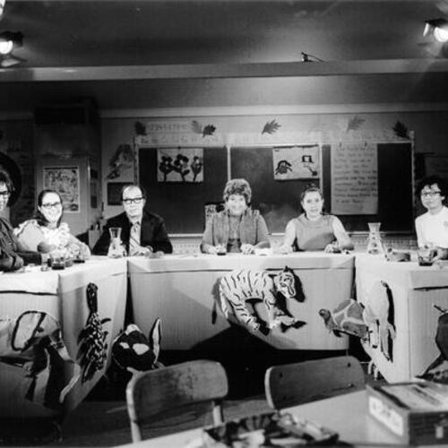 [Group of people participating in a panel discussion at Argonne School]
