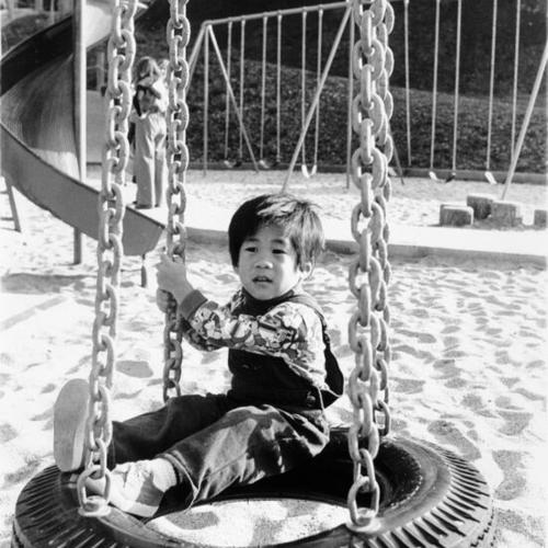 [Unknown child plays in the Children's Playground at Golden Gate Park]