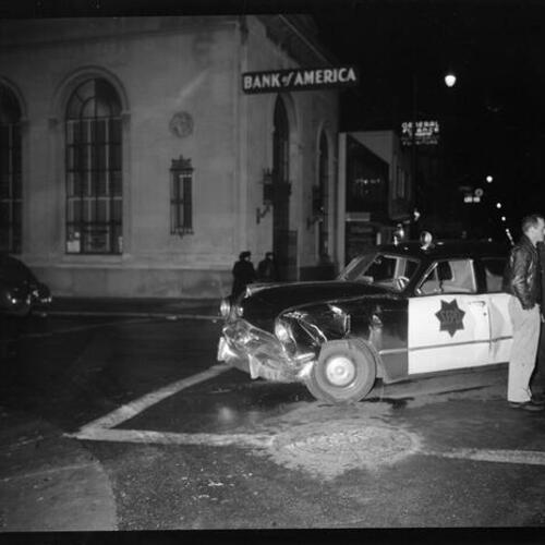 [Wrecked police car at 23rd and Mission, Bank of America in background]