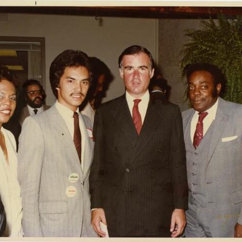 [Governor Jerry Brown with legislative aide Tim Dayonot and other aides]