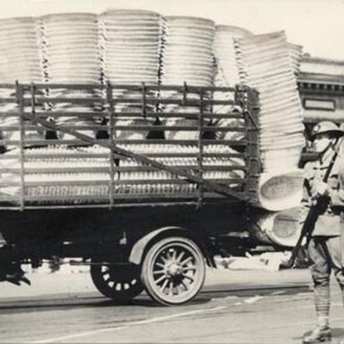 [Delivery truck being guarded by National Guard during general strike]