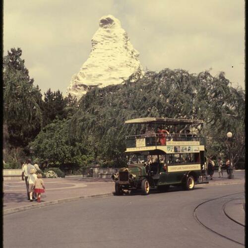 Disneyland bus with Matterhorn Bobsleds attraction in background