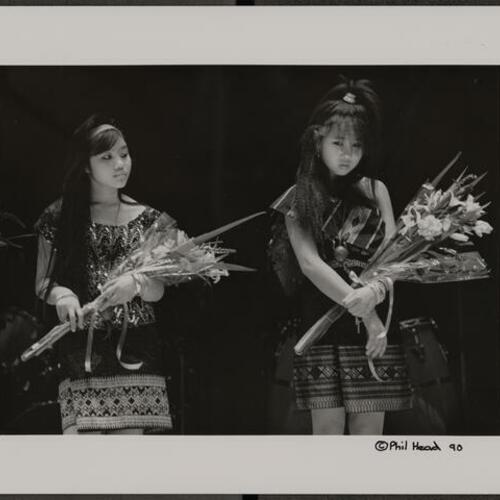 Teens with flowers at Lunar New Year celebration