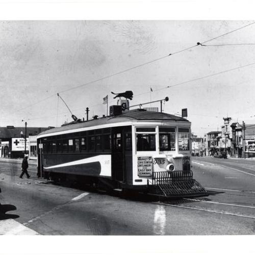 [Valencia and Mission streets looking northeast at #9 line car 935 heading onto Mission street]