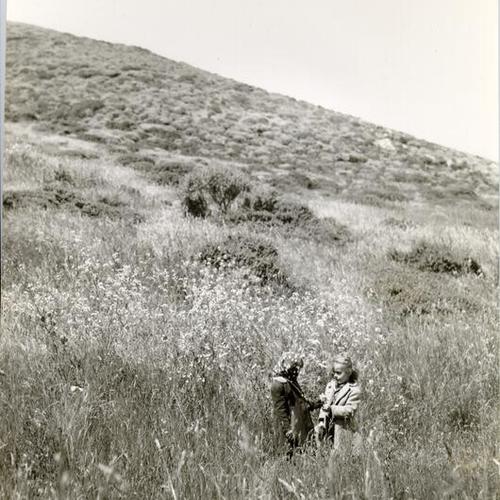 [Two children standing in a field on Mount Davidson]