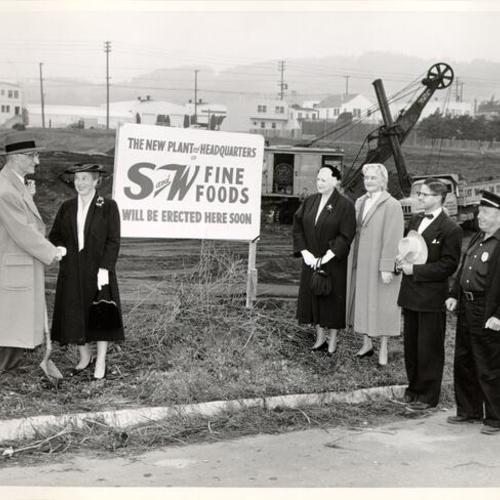 [Group of people standing in front of a construction site in Visitacion Valley]
