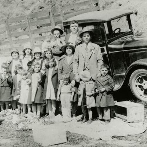 [Greek Orthodox families on a picnic with a truck]