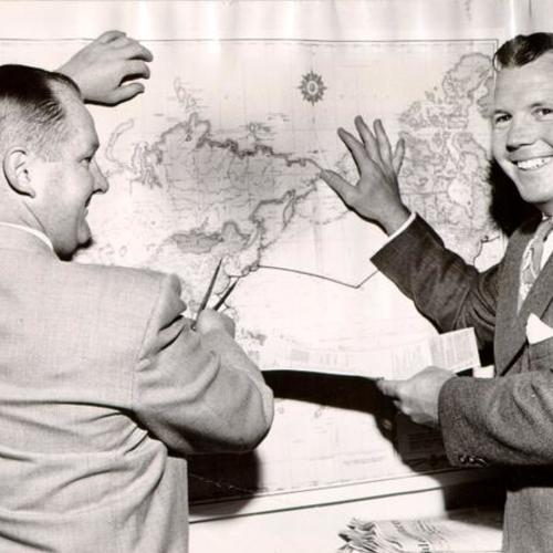 [Kenneth H. Finnesey, executive of the States Steamship Corporation, plotting the voyage of a trans-Pacific freighter with Captain J. W. Dickover]