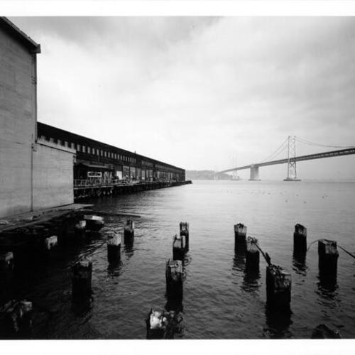 [Southern facade of Pier 16 with the Bay Bridge in the background]