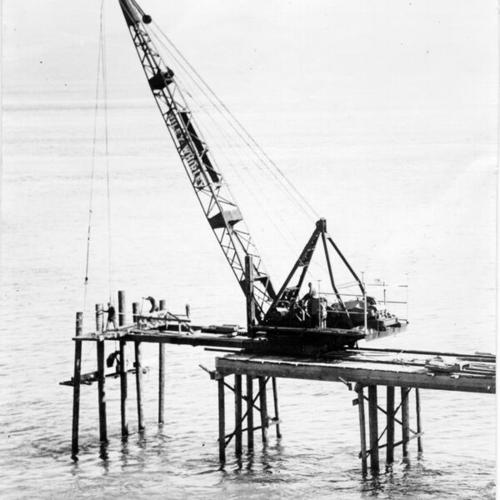 [Large crane in use in building trestle bridge to Golden Gate Bridge south tower base]