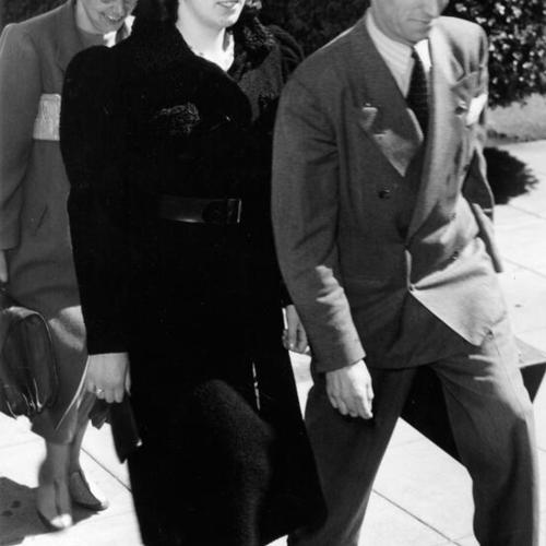 [Harry Bridges accompanied by his sister Jacqueline and his attorney Carol King]
