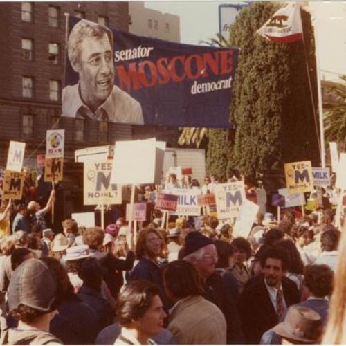 [A rally with banners and crowd of people at Union Square supporting Senator George Moscone running for Mayor and Harvey Milk for Supervisor]