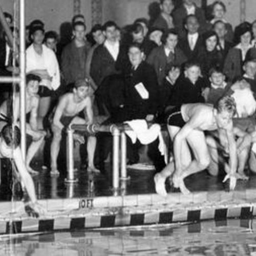 [Philip Little, Robert Arnold, Carter Anderson and Dave Johnson competing in a swimming competition at the Fairmont Hotel]