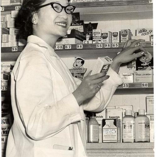 [Pharmacist Lela Dong at the Republic Drug Co. in Chinatown]